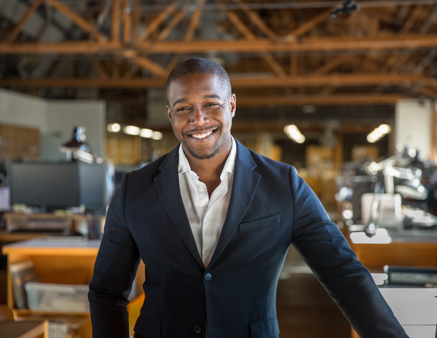 Happy smiling broker in a blue blazer jacket