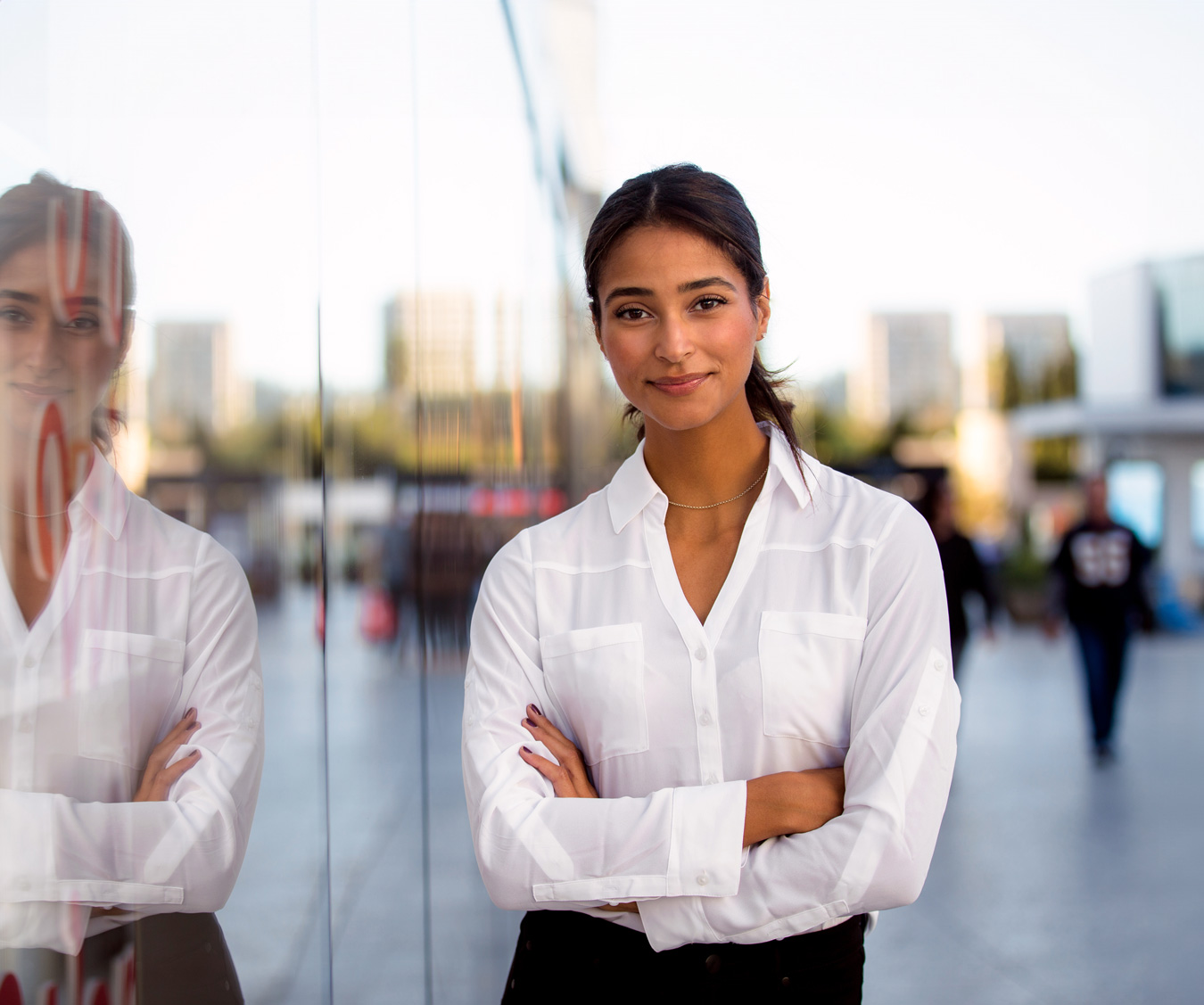 Female mortgage broker applicant smiling on city street