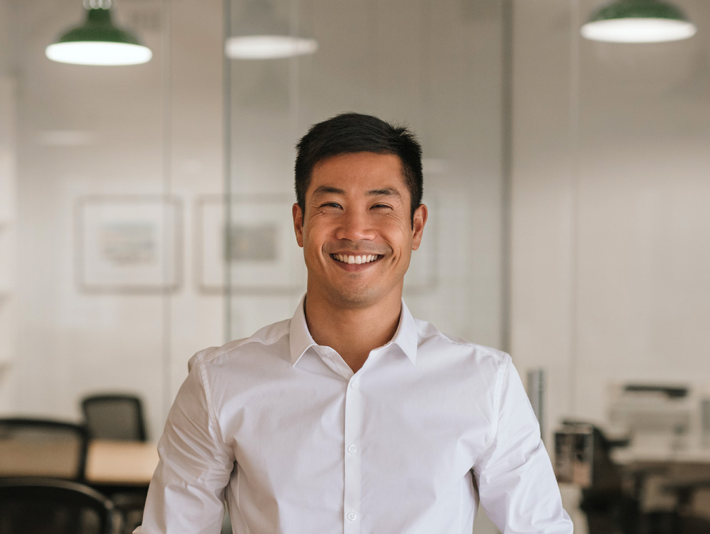 Man in white shirt smiling